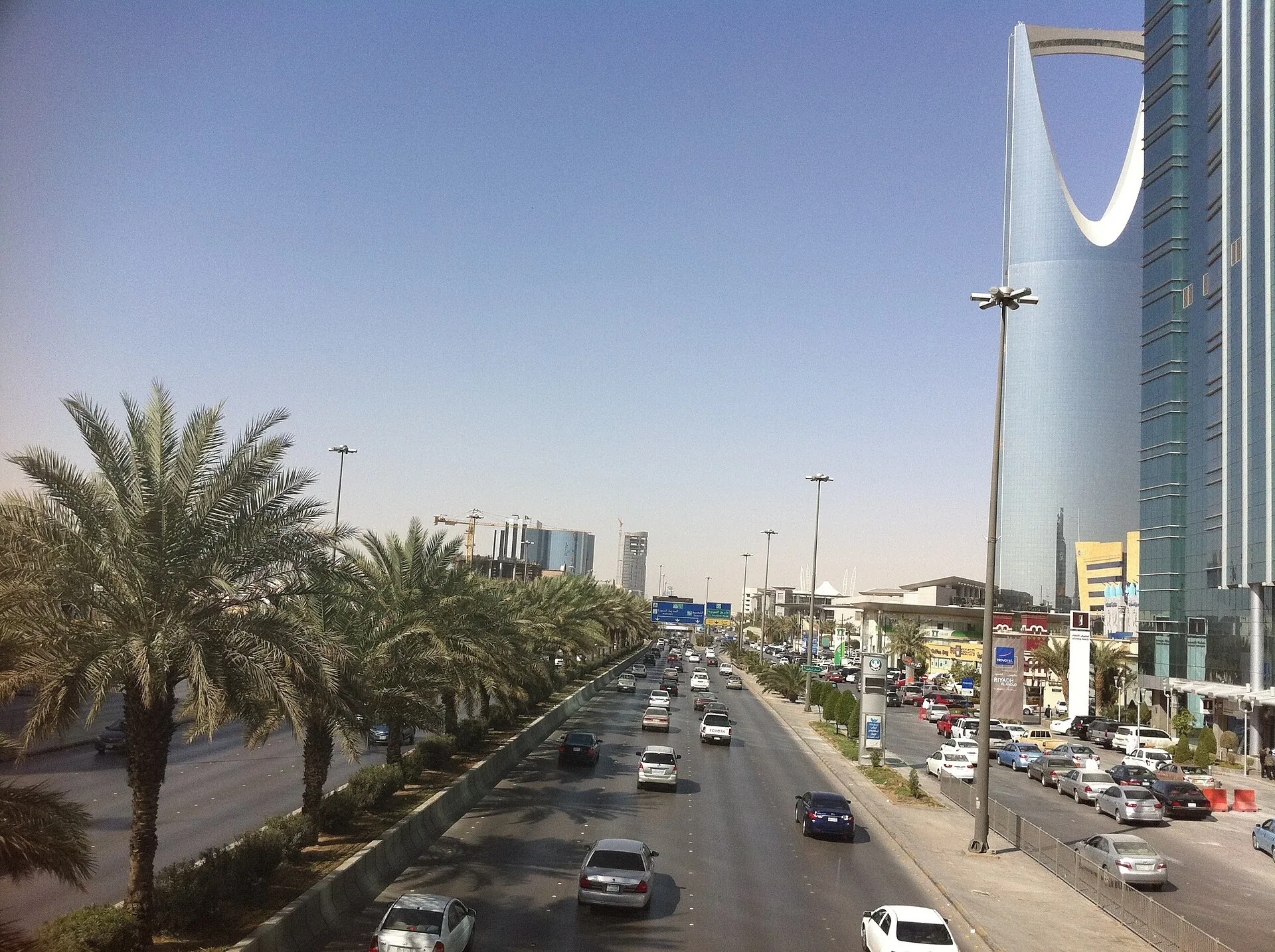 City street with kerbside parking and traffic